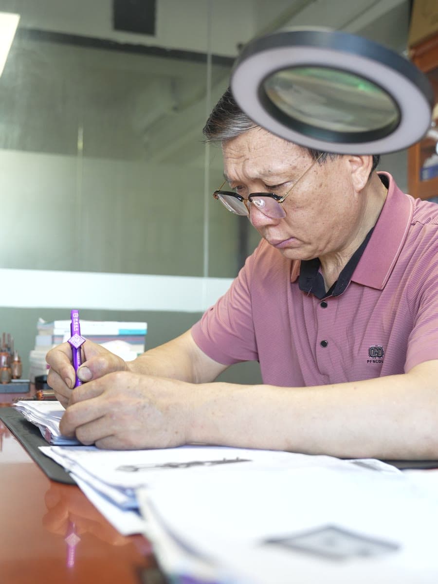 Checking a drawing under the magnifier
